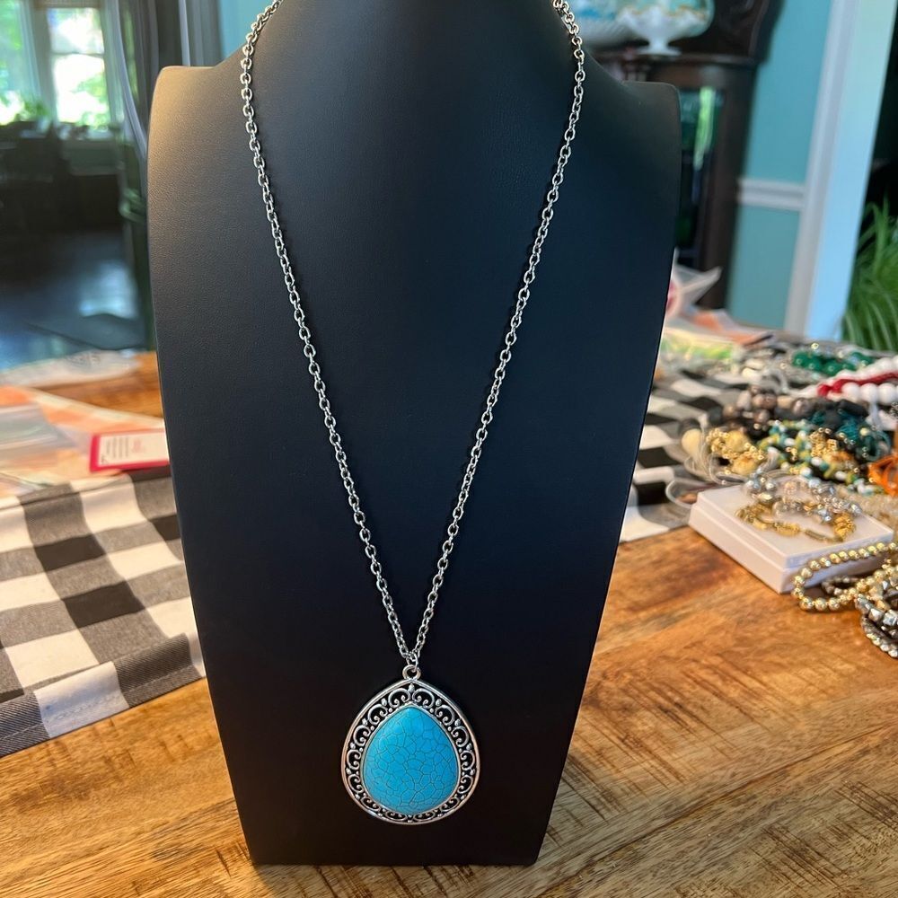 Turquoise pendant necklace and orange beaded necklace